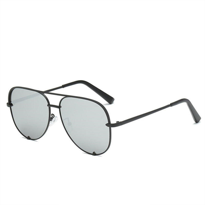 Oversized aviator glasses with black frame and pale gray lenses