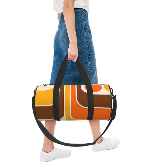 Person carrying the retro geometric duffel bag by its handles