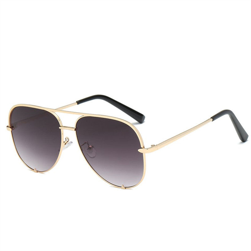 Oversized aviator glasses with gold-tone frame and dark lenses