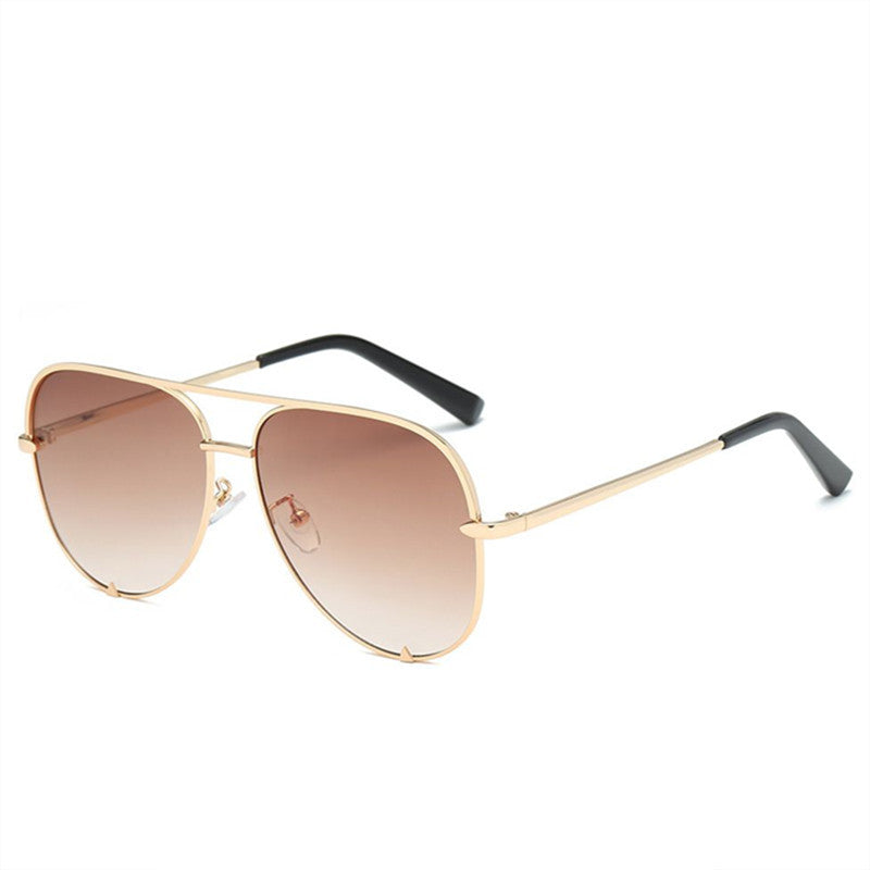 Oversized aviator glasses with gold-tone frame and brown gradient lenses