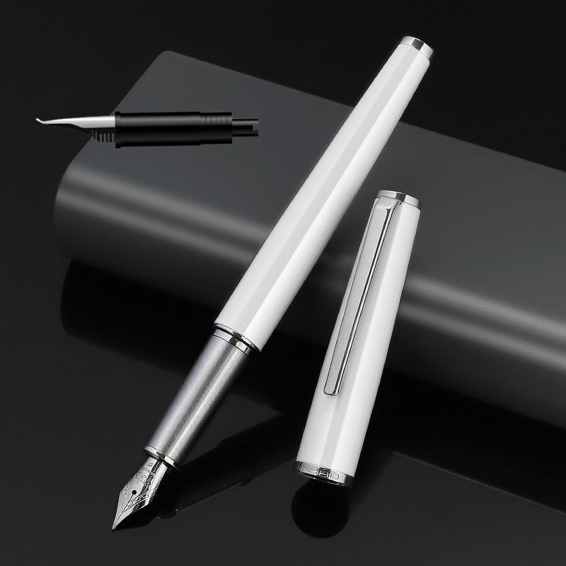 White fountain pen with cap and separate nib assembly on a dark background