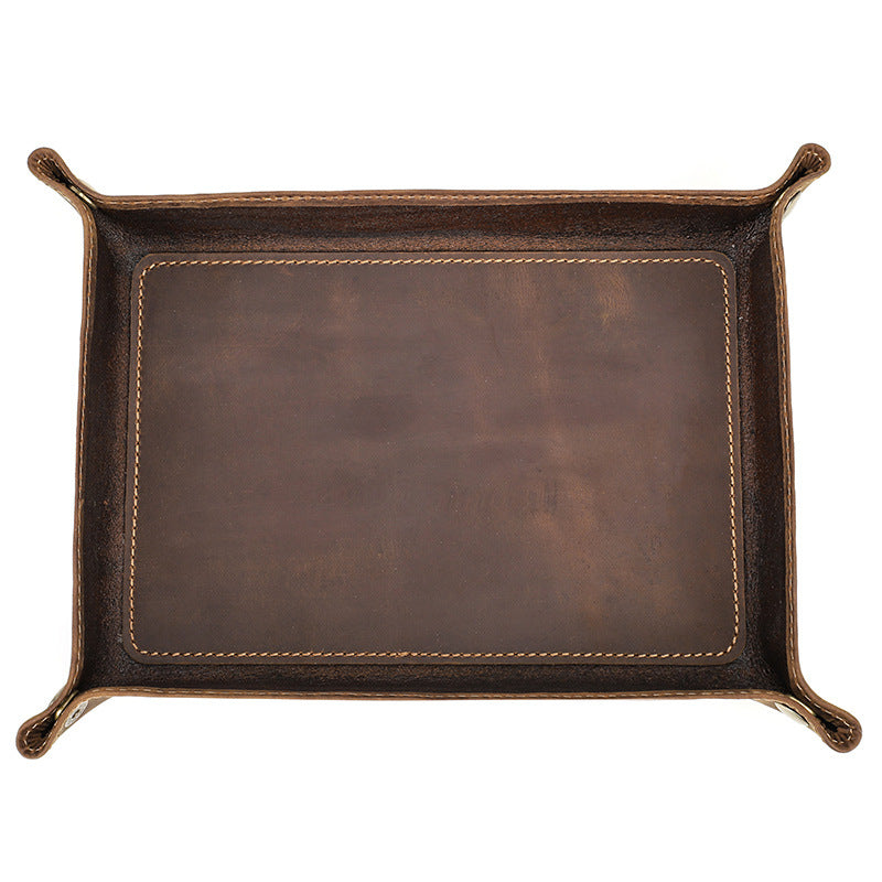 Top view of an empty brown rectangular valet tray on white
