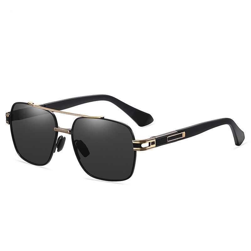 Rectangular dark-lens glasses with gold-tone bridge and temple details