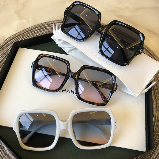 Set of oversized retro square sunglasses in black, tortoiseshell and white frames with UV400 protection, displayed with case