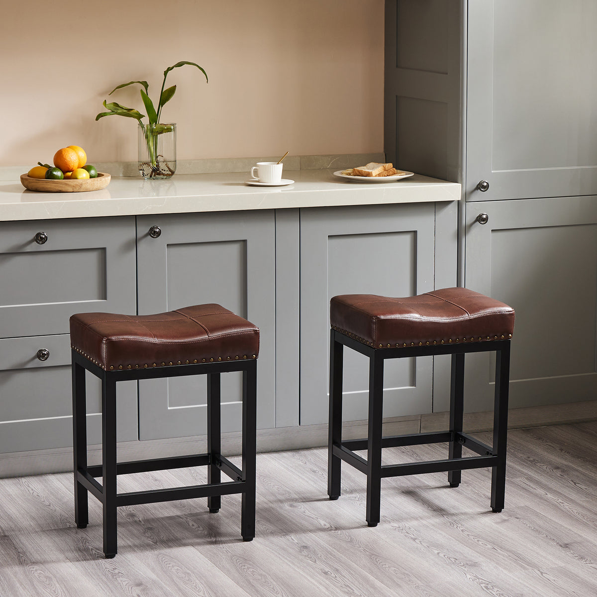 Two brown counter stools beside a kitchen island