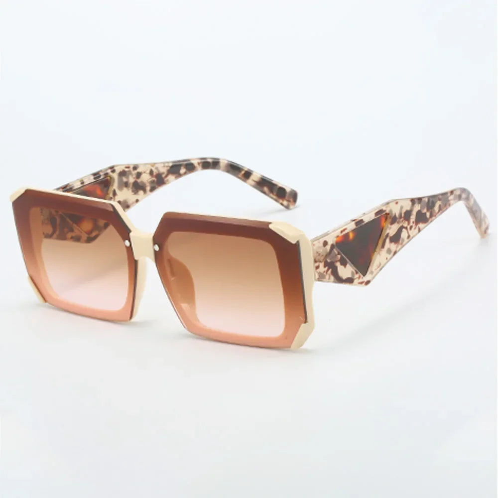 Peach-colored angular sunglasses with warm gradient lenses