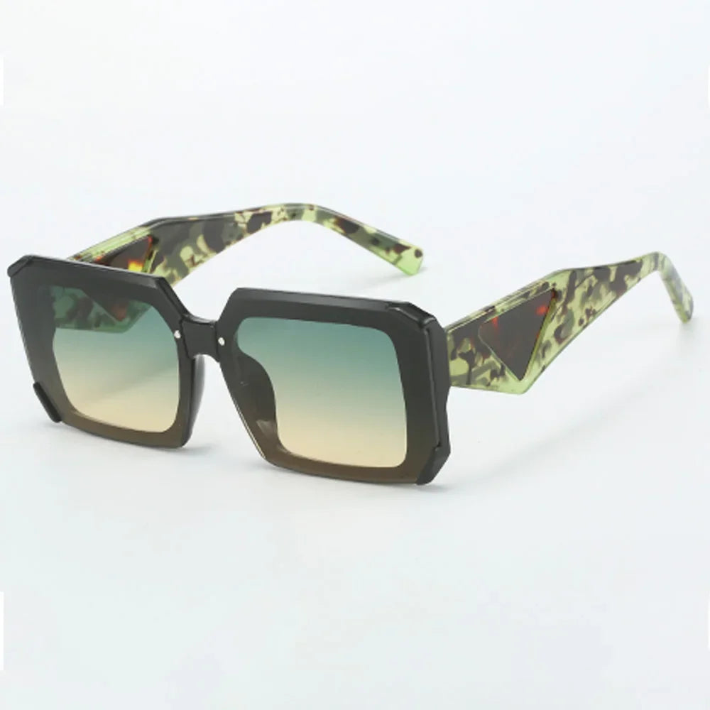Black angular sunglasses with green gradient lenses and patterned arms
