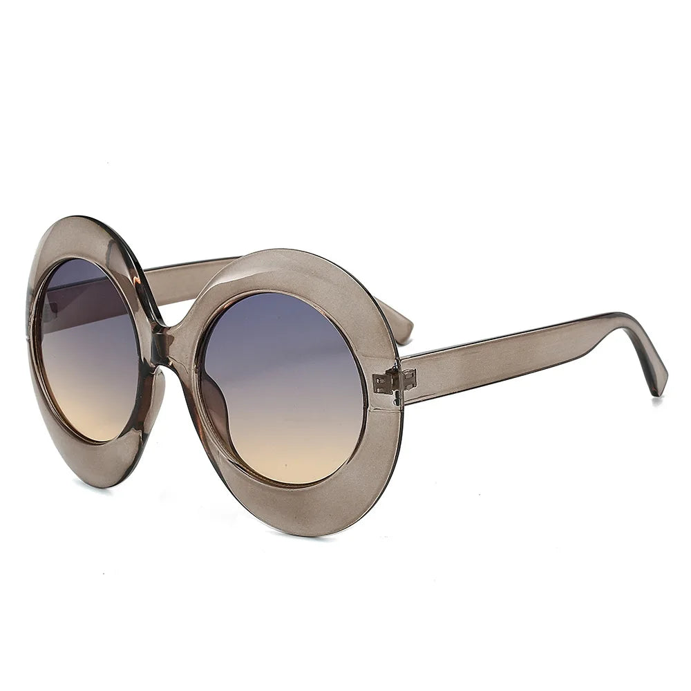 Oversized round smoke-colored sunglasses with gradient lenses