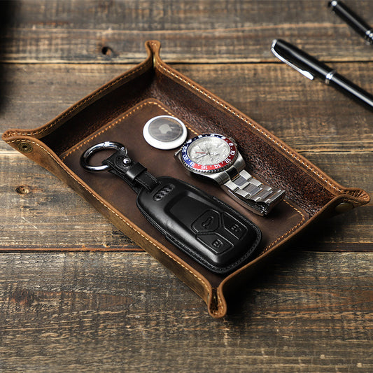 Brown snap-corner valet tray holding a watch, keys and small styling items